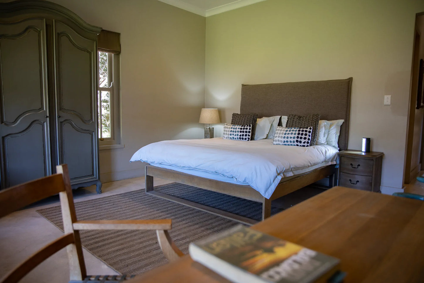 Peacehaven Cottage, a luxurious holiday home on the banks of the Breede River with a grand farmhouse feel. The property includes a spacious Manor House sleeping 8 guests and two stylishly converted Boat Sheds, each accommodating 2 guests.