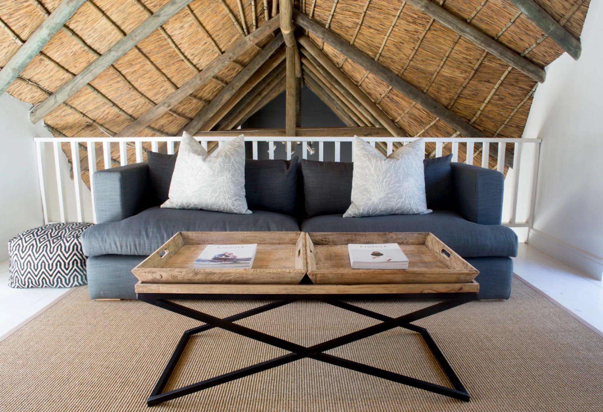 Candlewood Cottage, a thatched holiday villa in St. Francis Bay nestled among Candlewood trees. A serene self-catering retreat sleeping up to 8 guests, featuring elegant, pared-down interiors, a cosy loft with its own TV and kitchenette, and easy access to canals and the beach.