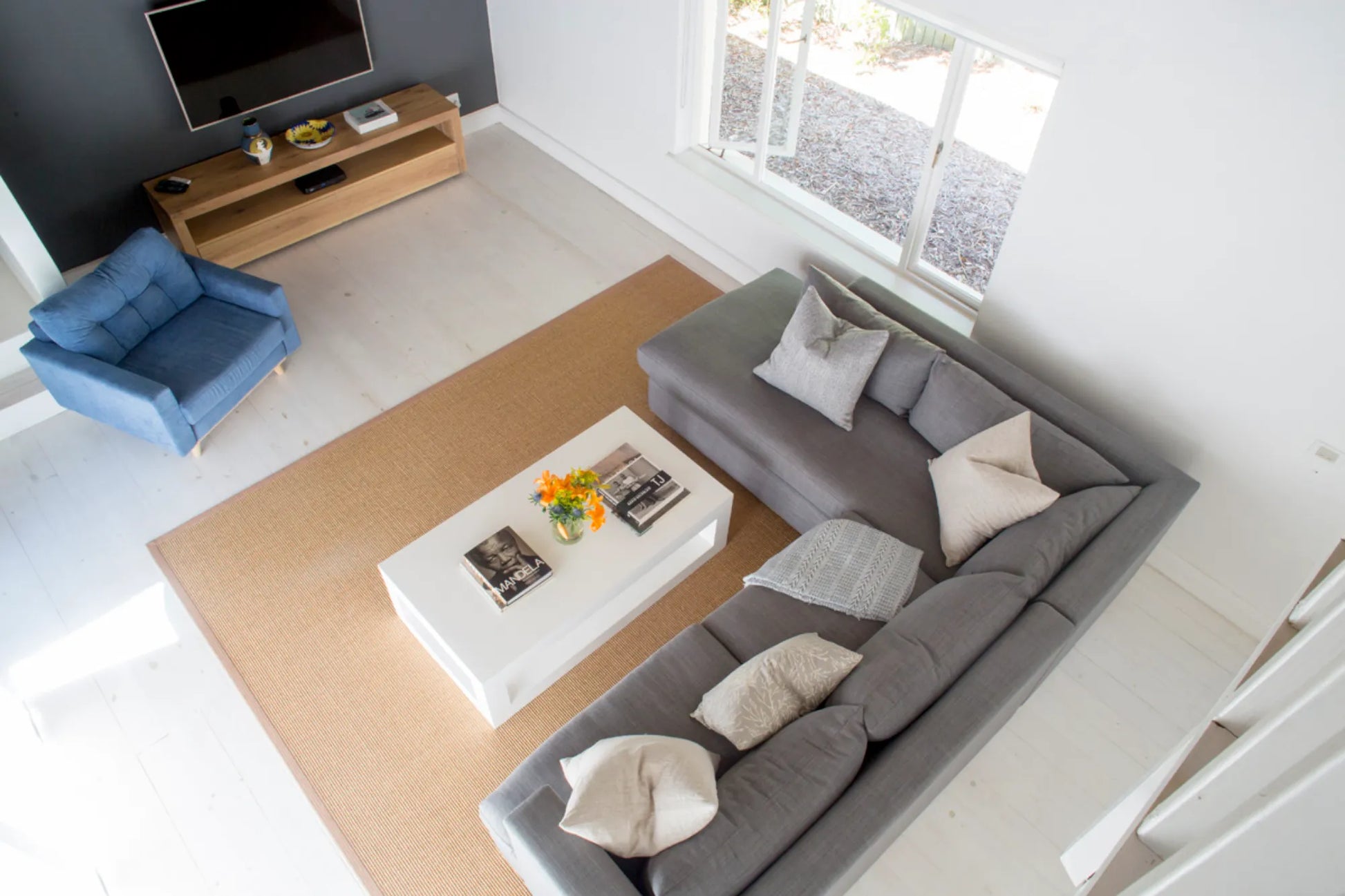 Candlewood Cottage, a thatched holiday villa in St. Francis Bay nestled among Candlewood trees. A serene self-catering retreat sleeping up to 8 guests, featuring elegant, pared-down interiors, a cosy loft with its own TV and kitchenette, and easy access to canals and the beach.