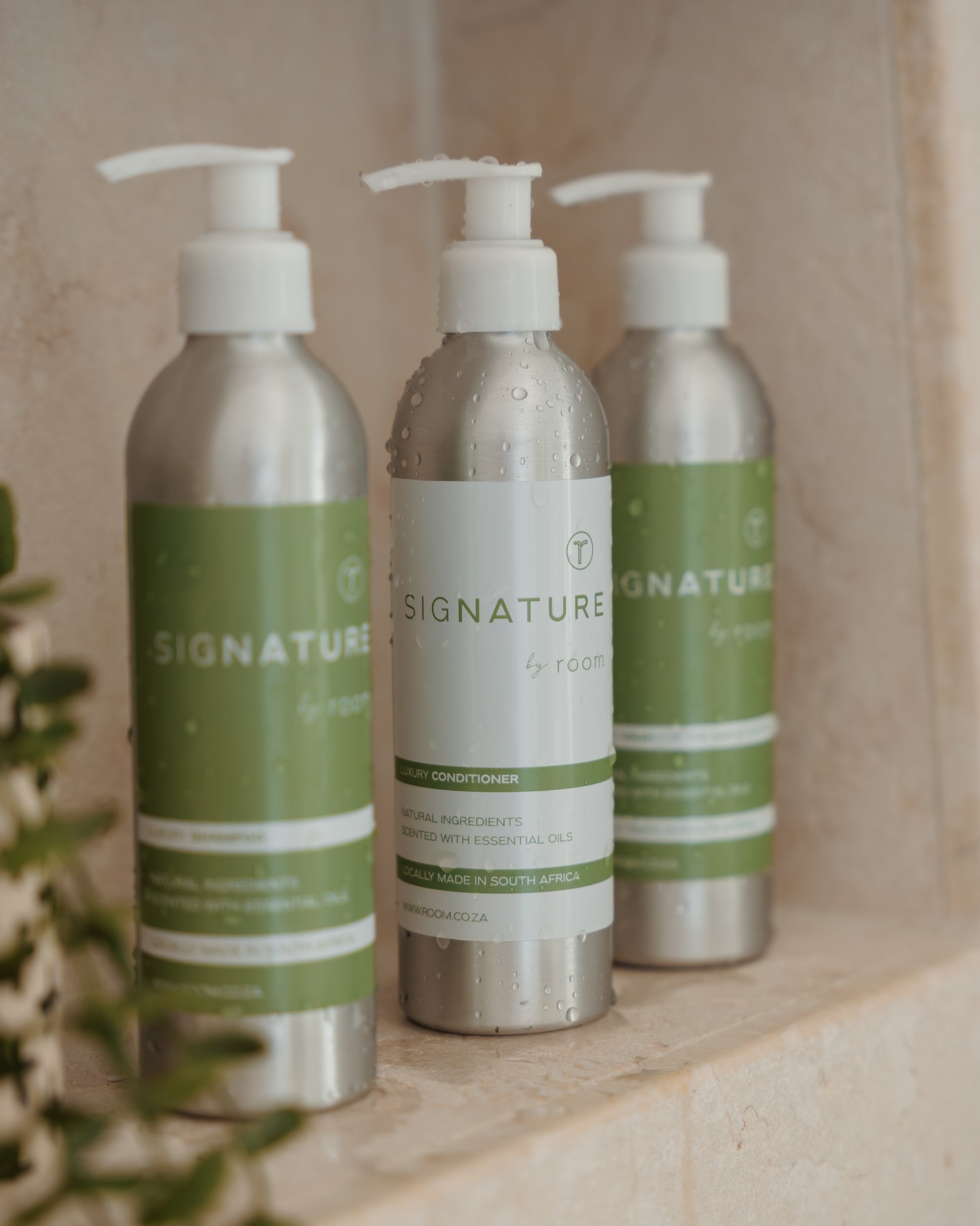 "sigNATURE natural conditioner, infused with pure essential oils for a perfume-like scent. Luxuriously hydrating and locally crafted, this nourishing formula leaves hair soft, smooth, and naturally scented — free from SLS, parabens, and palm oil.