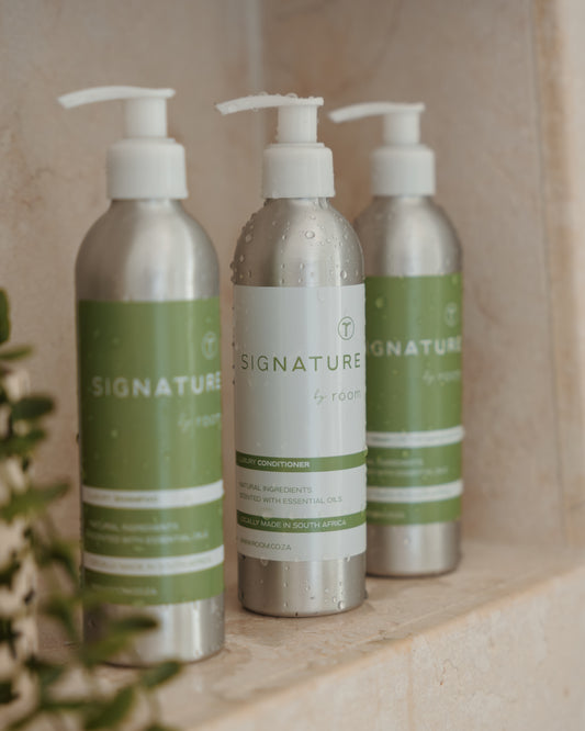 "sigNATURE natural conditioner, infused with pure essential oils for a perfume-like scent. Luxuriously hydrating and locally crafted, this nourishing formula leaves hair soft, smooth, and naturally scented — free from SLS, parabens, and palm oil.
