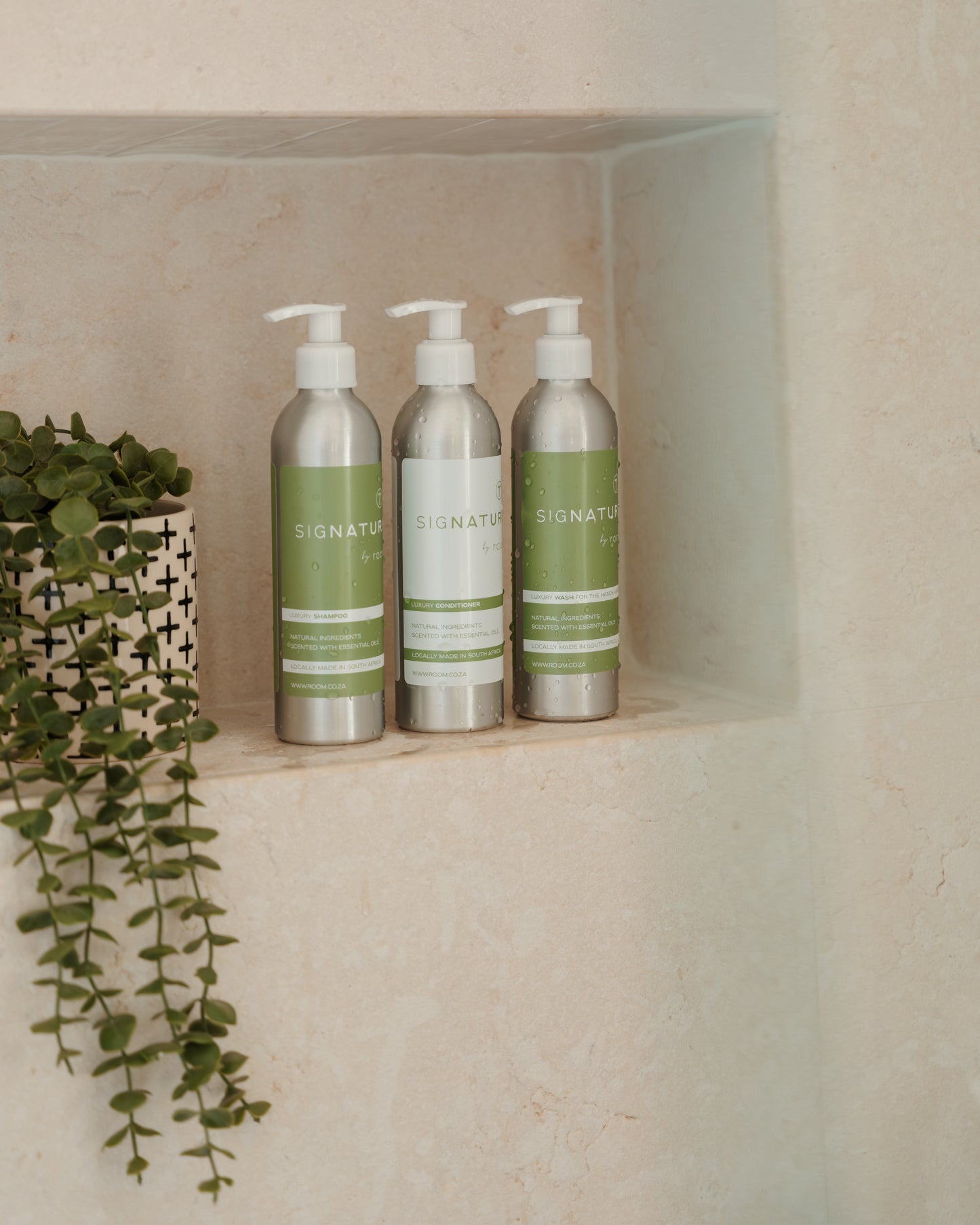 Natural care trio featuring sigNATURE Wash, Shampoo, and Conditioner — all infused with pure essential oils for a luxurious, perfume-like scent. Gentle on skin and hair, locally made, and free from SLS, parabens, and palm oil.