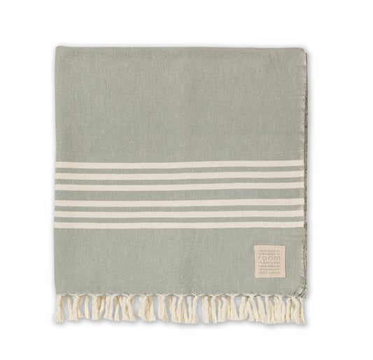 The Barrydale Hand Weavers' 100% Cotton Hand Towel in The Room Key's&nbsp;green and grey is a handwoven textile crafted from 100% locally sourced, unbleached cotton. Measuring approximately 85cm in width and 160cm in length, this towel offers ample coverage for various uses.