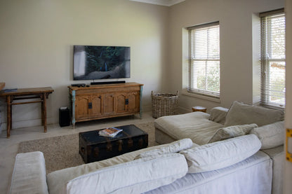 Peacehaven Cottage, a luxurious holiday home on the banks of the Breede River with a grand farmhouse feel. The property includes a spacious Manor House sleeping 8 guests and two stylishly converted Boat Sheds, each accommodating 2 guests.