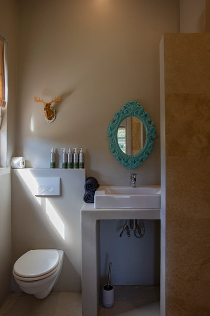 Peacehaven Cottage, a luxurious holiday home on the banks of the Breede River with a grand farmhouse feel. The property includes a spacious Manor House sleeping 8 guests and two stylishly converted Boat Sheds, each accommodating 2 guests.