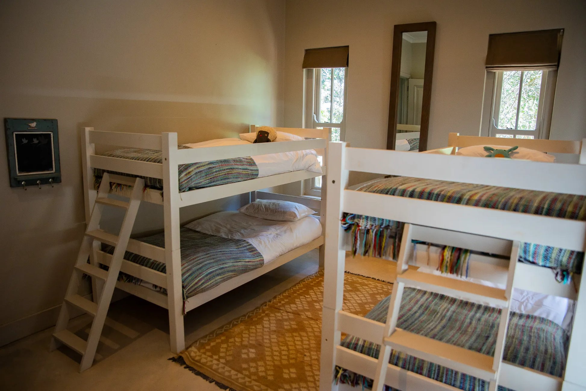 Peacehaven Cottage, a luxurious holiday home on the banks of the Breede River with a grand farmhouse feel. The property includes a spacious Manor House sleeping 8 guests and two stylishly converted Boat Sheds, each accommodating 2 guests.