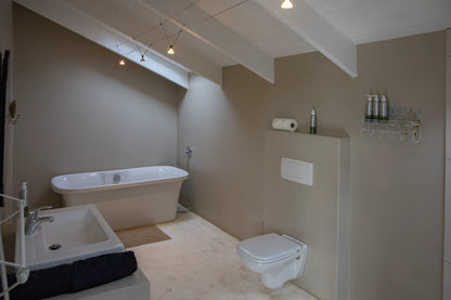 Peacehaven Cottage, a luxurious holiday home on the banks of the Breede River with a grand farmhouse feel. The property includes a spacious Manor House sleeping 8 guests and two stylishly converted Boat Sheds, each accommodating 2 guests.