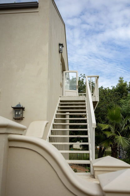 Peacehaven Cottage, a luxurious holiday home on the banks of the Breede River with a grand farmhouse feel. The property includes a spacious Manor House sleeping 8 guests and two stylishly converted Boat Sheds, each accommodating 2 guests.