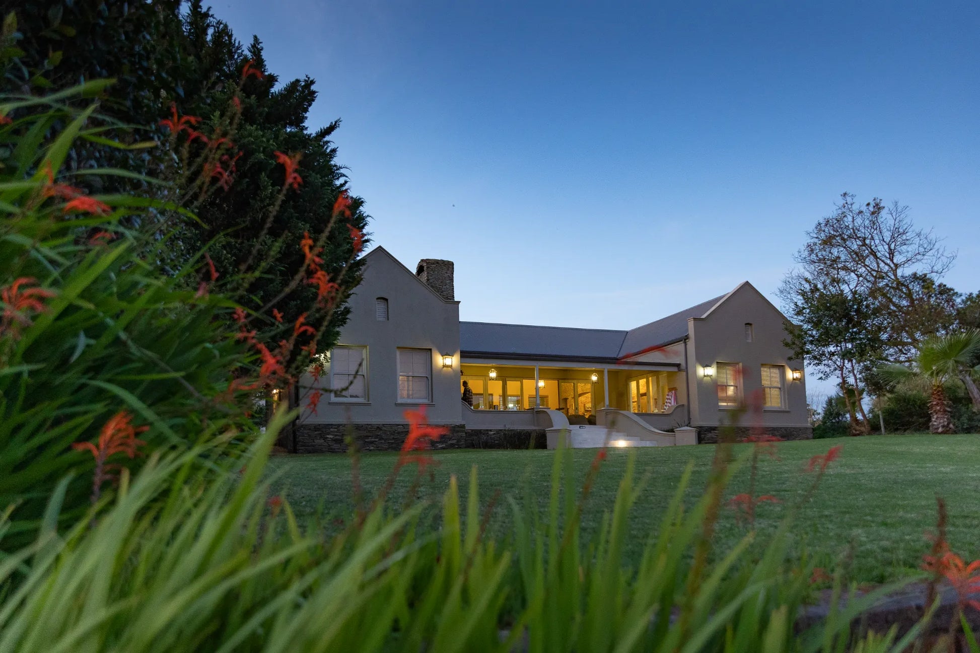 Peacehaven Cottage, a luxurious holiday home on the banks of the Breede River with a grand farmhouse feel. The property includes a spacious Manor House sleeping 8 guests and two stylishly converted Boat Sheds, each accommodating 2 guests.