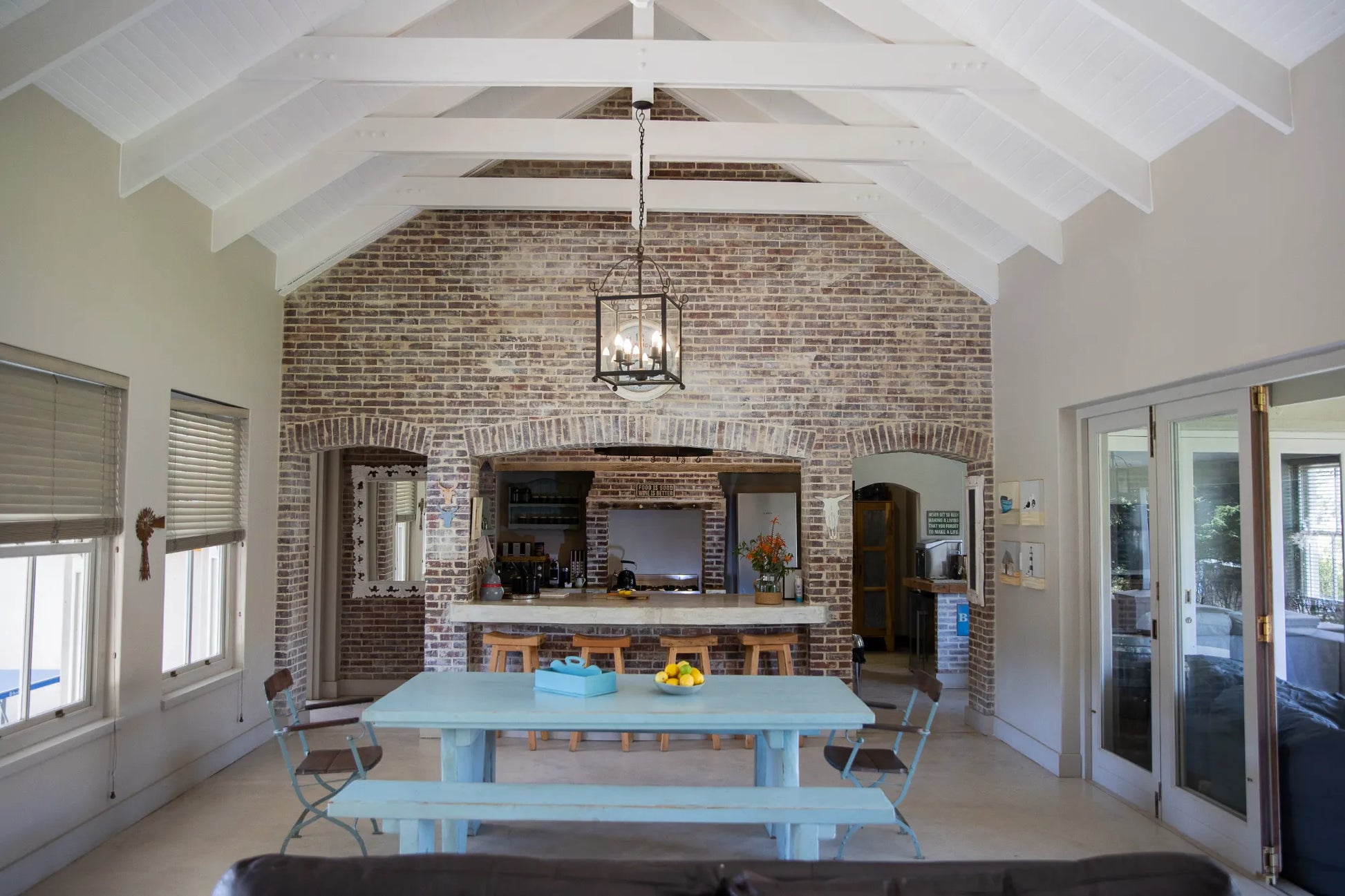 Peacehaven Cottage, a luxurious holiday home on the banks of the Breede River with a grand farmhouse feel. The property includes a spacious Manor House sleeping 8 guests and two stylishly converted Boat Sheds, each accommodating 2 guests.