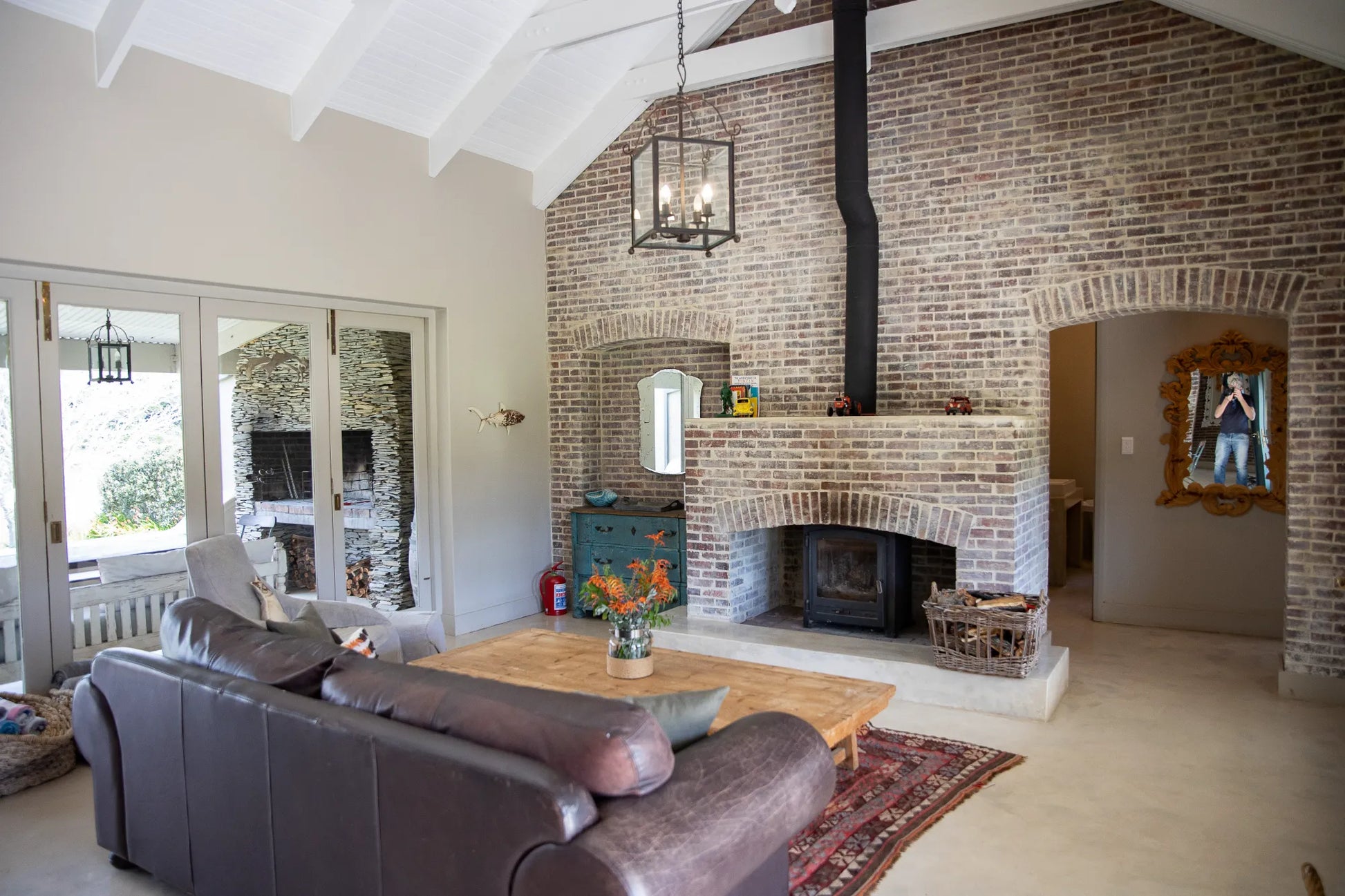 Peacehaven Cottage, a luxurious holiday home on the banks of the Breede River with a grand farmhouse feel. The property includes a spacious Manor House sleeping 8 guests and two stylishly converted Boat Sheds, each accommodating 2 guests.