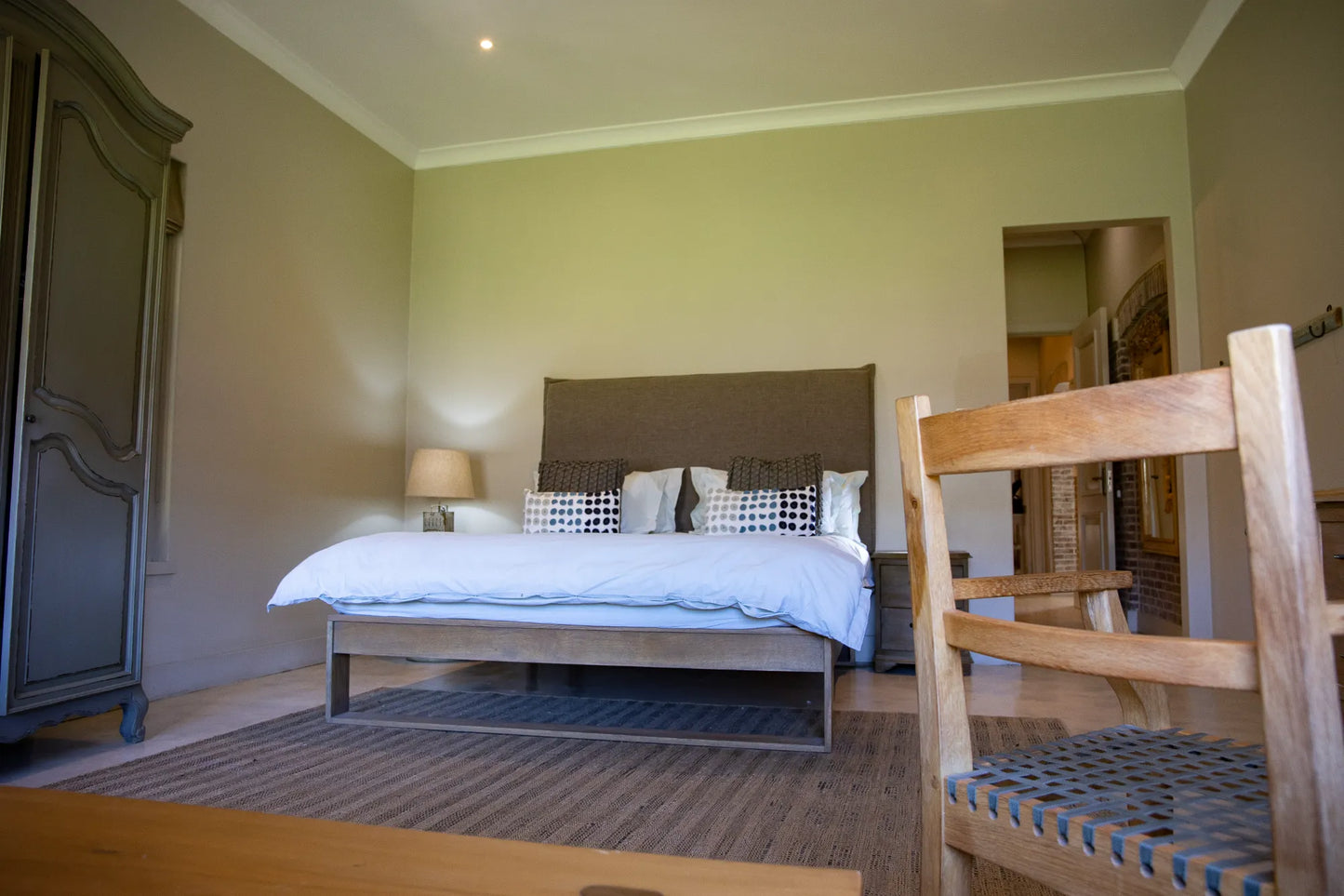 Peacehaven Cottage, a luxurious holiday home on the banks of the Breede River with a grand farmhouse feel. The property includes a spacious Manor House sleeping 8 guests and two stylishly converted Boat Sheds, each accommodating 2 guests.