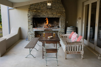 Peacehaven Cottage, a luxurious holiday home on the banks of the Breede River with a grand farmhouse feel. The property includes a spacious Manor House sleeping 8 guests and two stylishly converted Boat Sheds, each accommodating 2 guests.