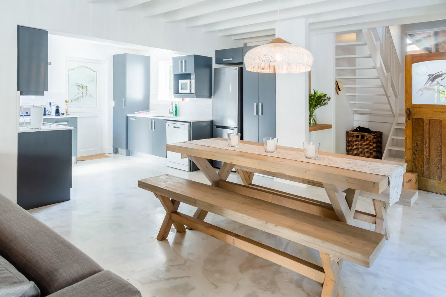 Candlewood Cottage, a thatched holiday villa in St. Francis Bay nestled among Candlewood trees. A serene self-catering retreat sleeping up to 8 guests, featuring elegant, pared-down interiors, a cosy loft with its own TV and kitchenette, and easy access to canals and the beach.