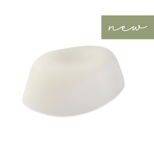 Natural pebble-shaped soap handcrafted with pure essential oils—Neroli, Vetiver, Lemon Verbena, Bitter Orange, and Frankincense. Creates a rich, moisturizing lather with a perfume-like scent. SLS, paraben, and palm oil free.
